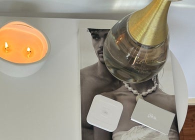Elegant display with a candle and perfume at Glos Skin & Beauty, Helensvale, Queensland, AU.