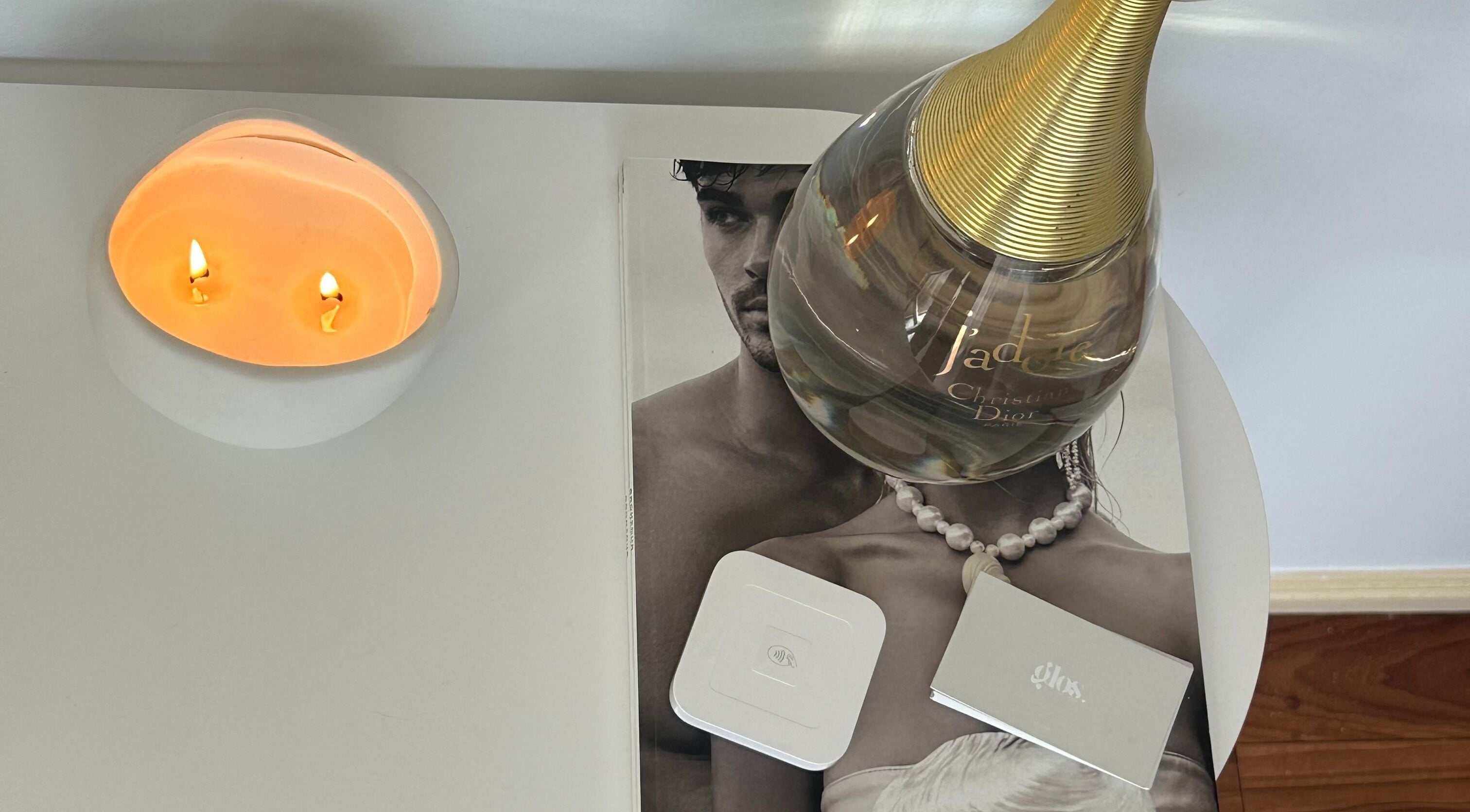 Elegant display with a candle and perfume at Glos Skin & Beauty, Helensvale, Queensland, AU.