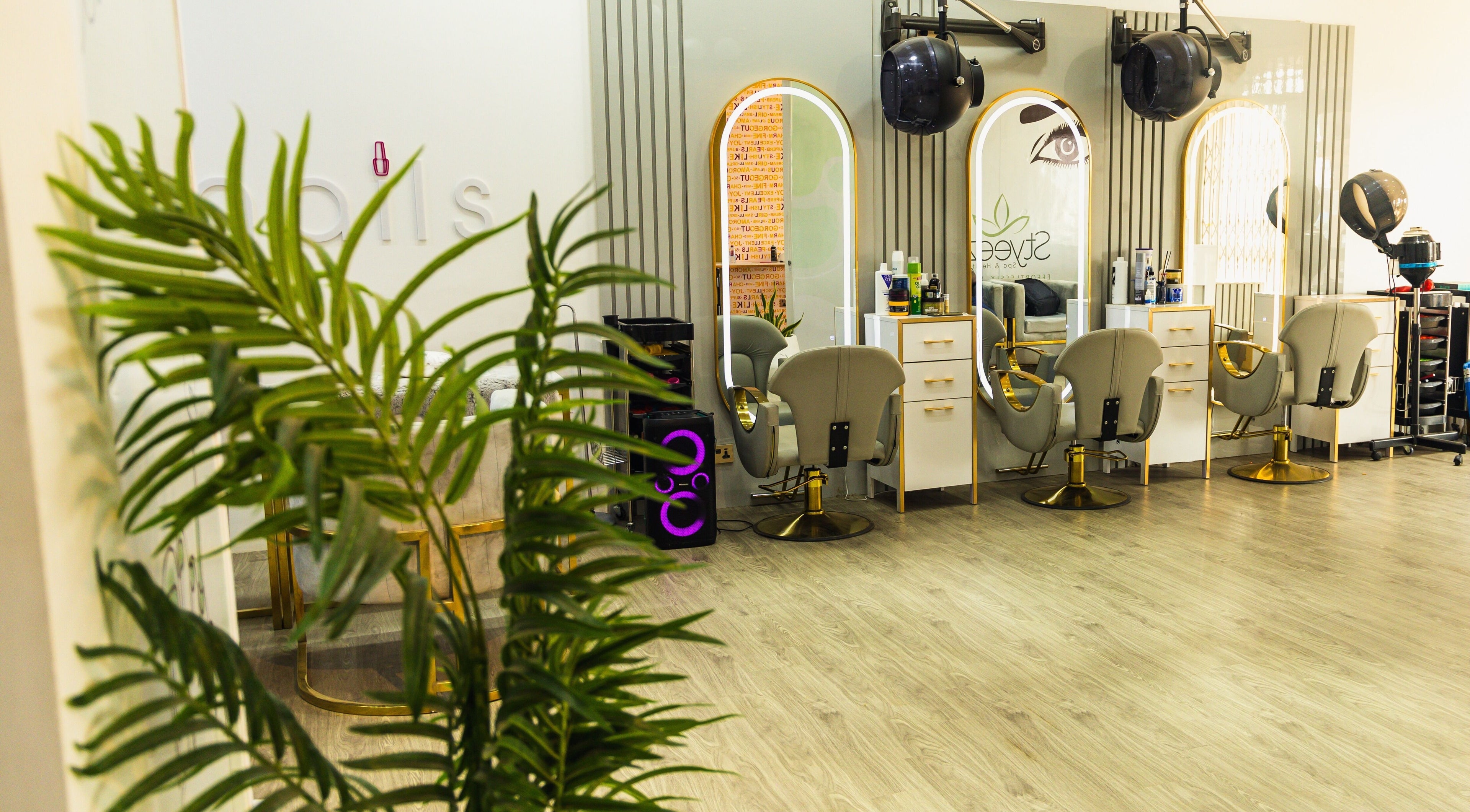 Interior of Styeeze Spa and Health Club in Greater Accra Region, showcasing modern salon chairs and mirrors.