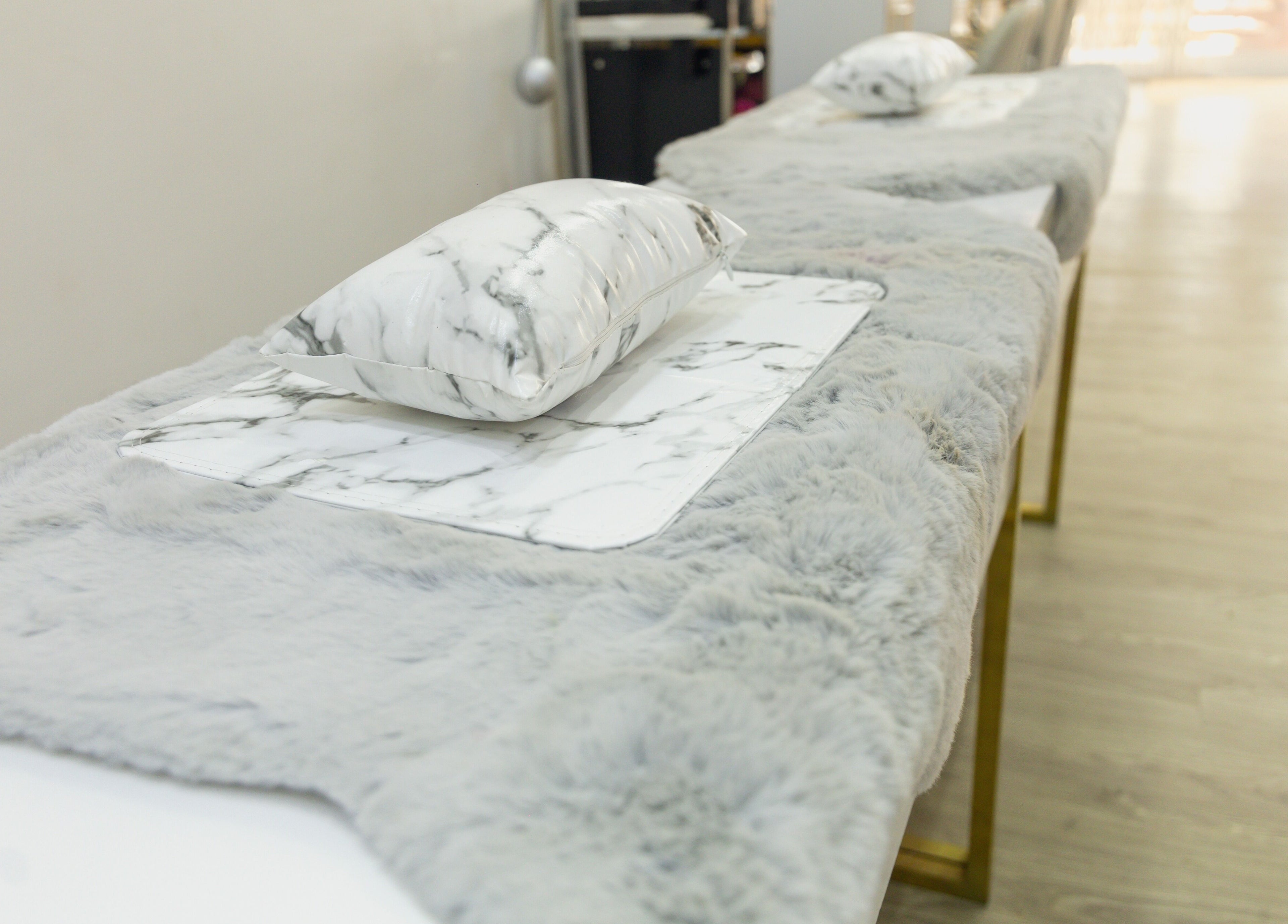 Cozy massage tables with luxurious marble pillows at Styeeze Spa and Health Club, Greater Accra Region, GH.