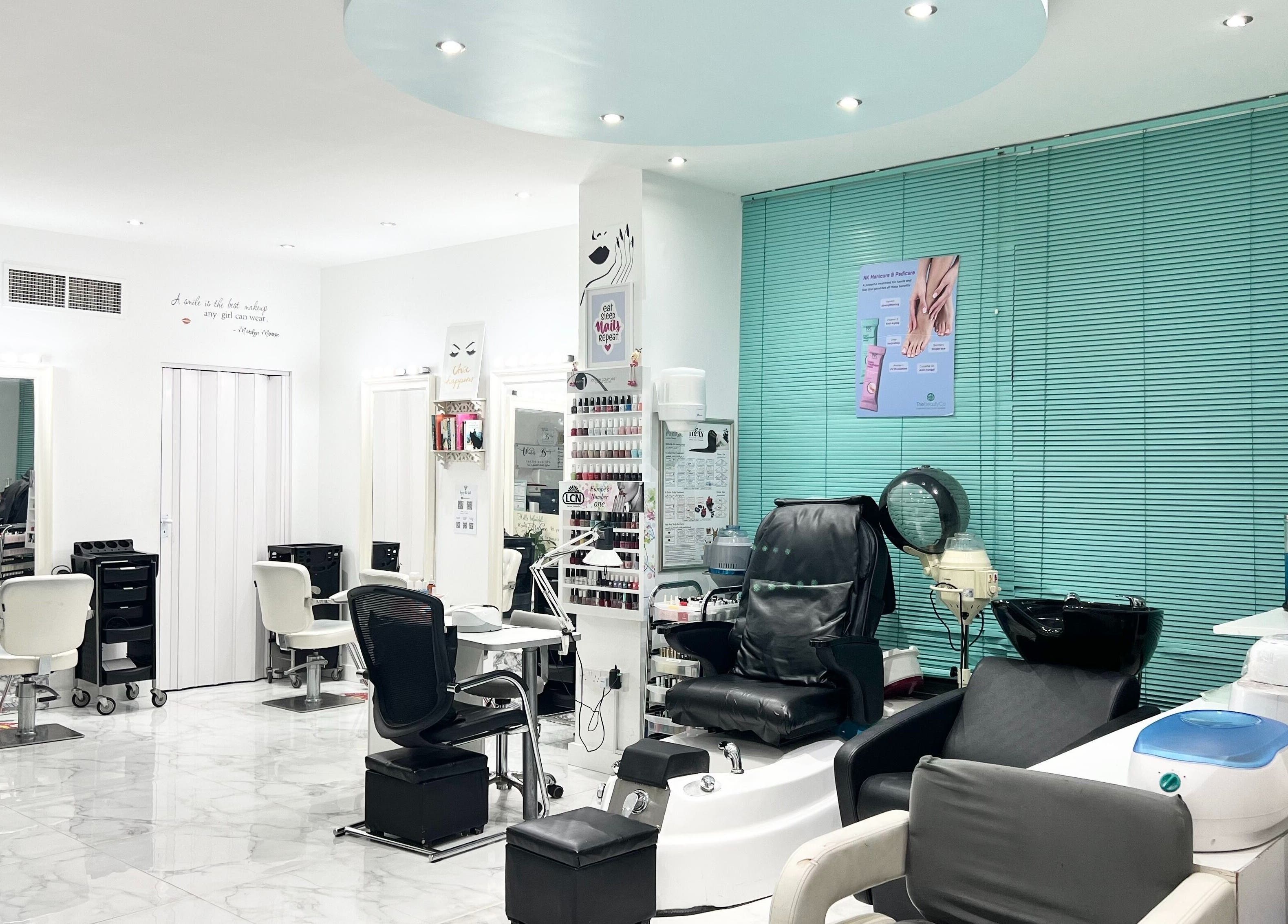Winter Beauty Salon And Spa in Abu Dhabi, AE showcases elegant styling chairs and modern nail care stations.