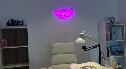 Nail salon interior with neon sign at deepsdivinitynailz, Manama, Muḥāfaẓat Al-ʿāṣimah, BH.