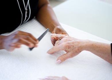 Professional manicure at Mint Salon, Johannesburg, Gauteng, ZA, showcasing detailed nail care.