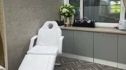 Elegant therapy room at Sculpt Beauty&Aesthetics, Lisburn, Northern Ireland, GB, featuring modern decor and treatment bed.