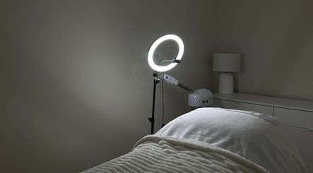Tranquil treatment room at Sofia’s Skin Space, Louth, England, GB featuring cozy blanket and ambient lighting.