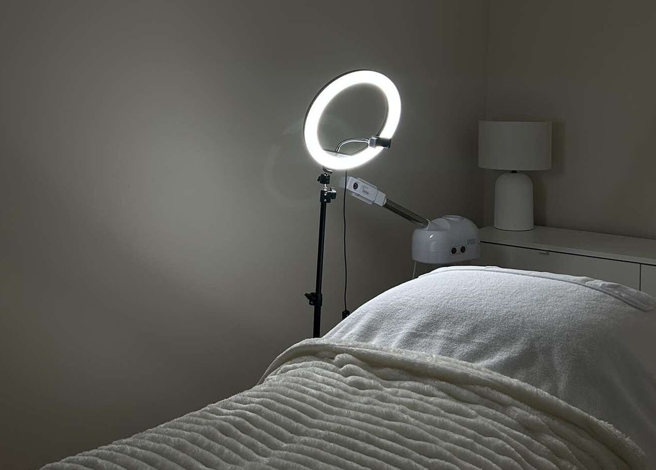 Tranquil treatment room at Sofia’s Skin Space, Louth, England, GB, featuring a cozy bed and modern lighting.