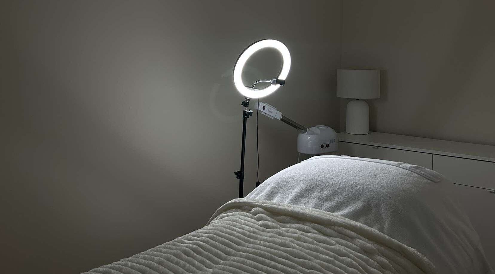 Tranquil treatment room at Sofia’s Skin Space, Louth, England, GB, featuring a cozy bed and modern lighting.