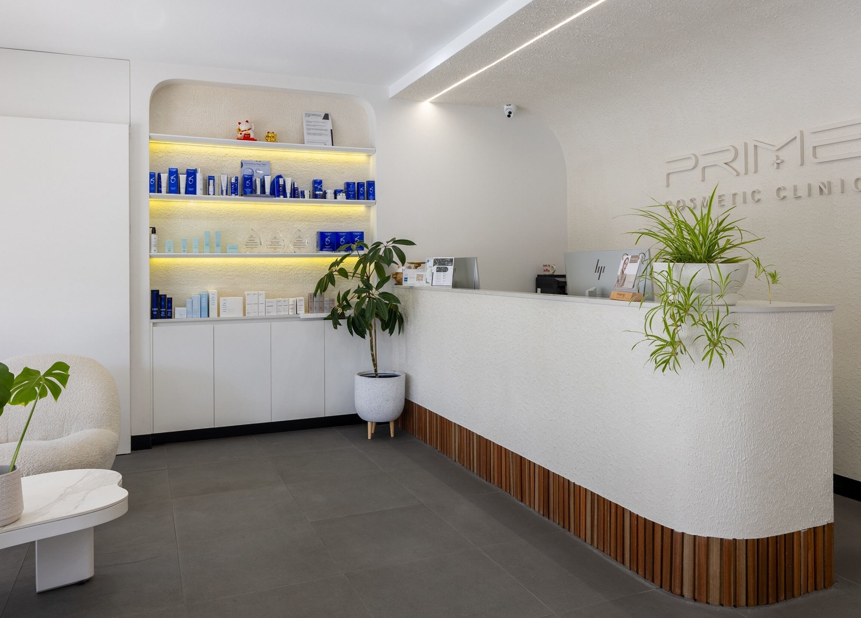 Reception area of Prime Cosmetic Clinic - Melbourne, Camberwell, Victoria, AU with sleek design and product display.