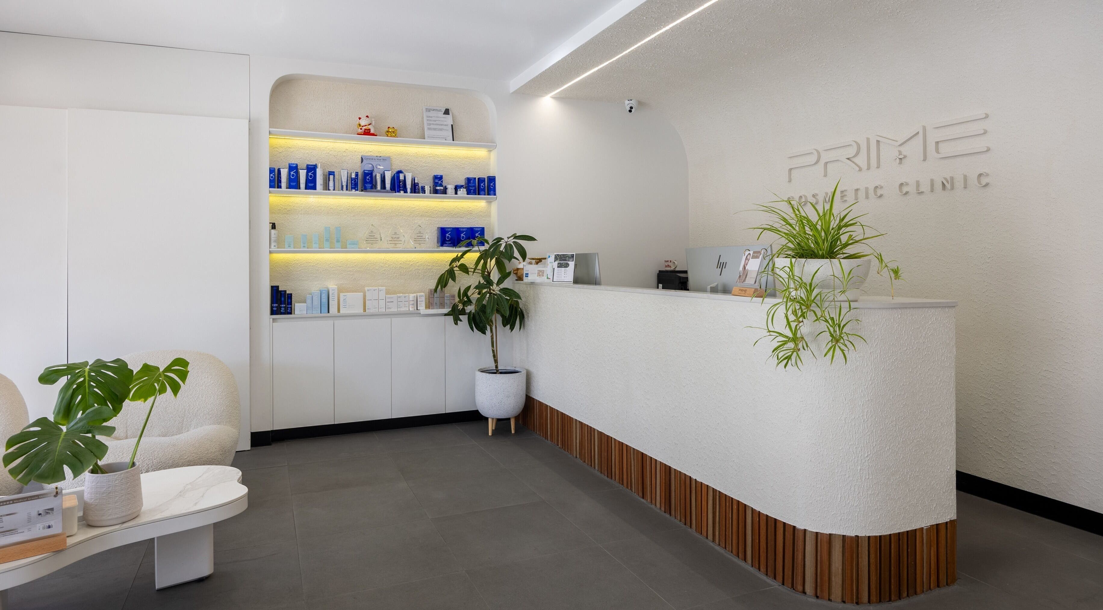 Reception area of Prime Cosmetic Clinic - Melbourne, Camberwell, Victoria, AU with sleek design and product display.