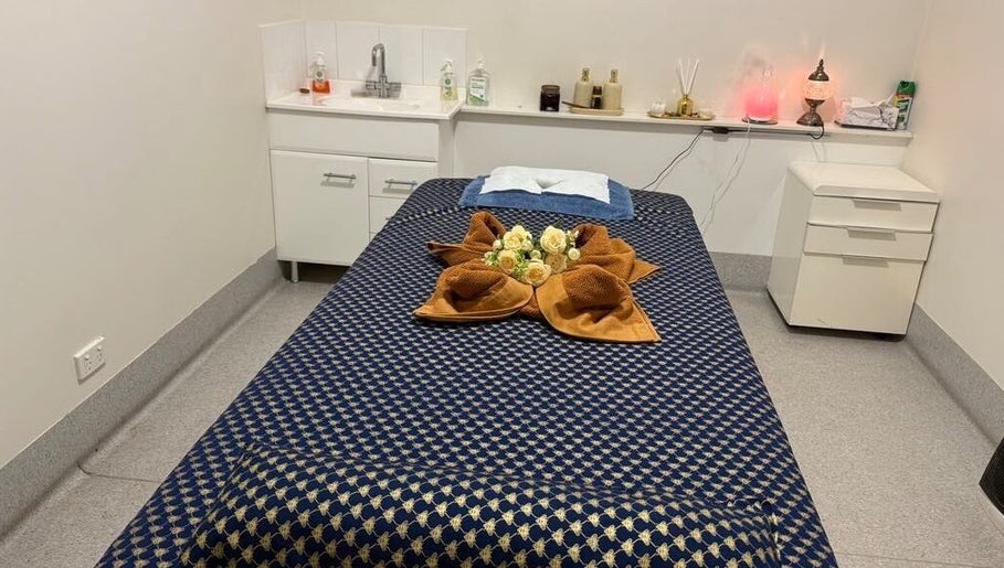 Relaxing treatment room at Hunter Thai Massage, Newcastle, New South Wales, AU, with cozy massage bed setup.