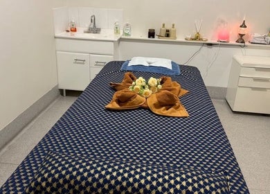 Relaxing treatment room at Hunter Thai Massage, Newcastle, New South Wales, AU, with cozy massage bed setup.