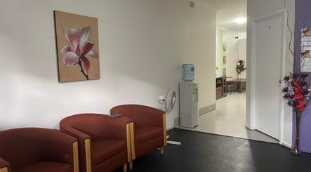 Welcoming lobby with floral artwork at Hunter Thai Massage, Newcastle, New South Wales, AU.