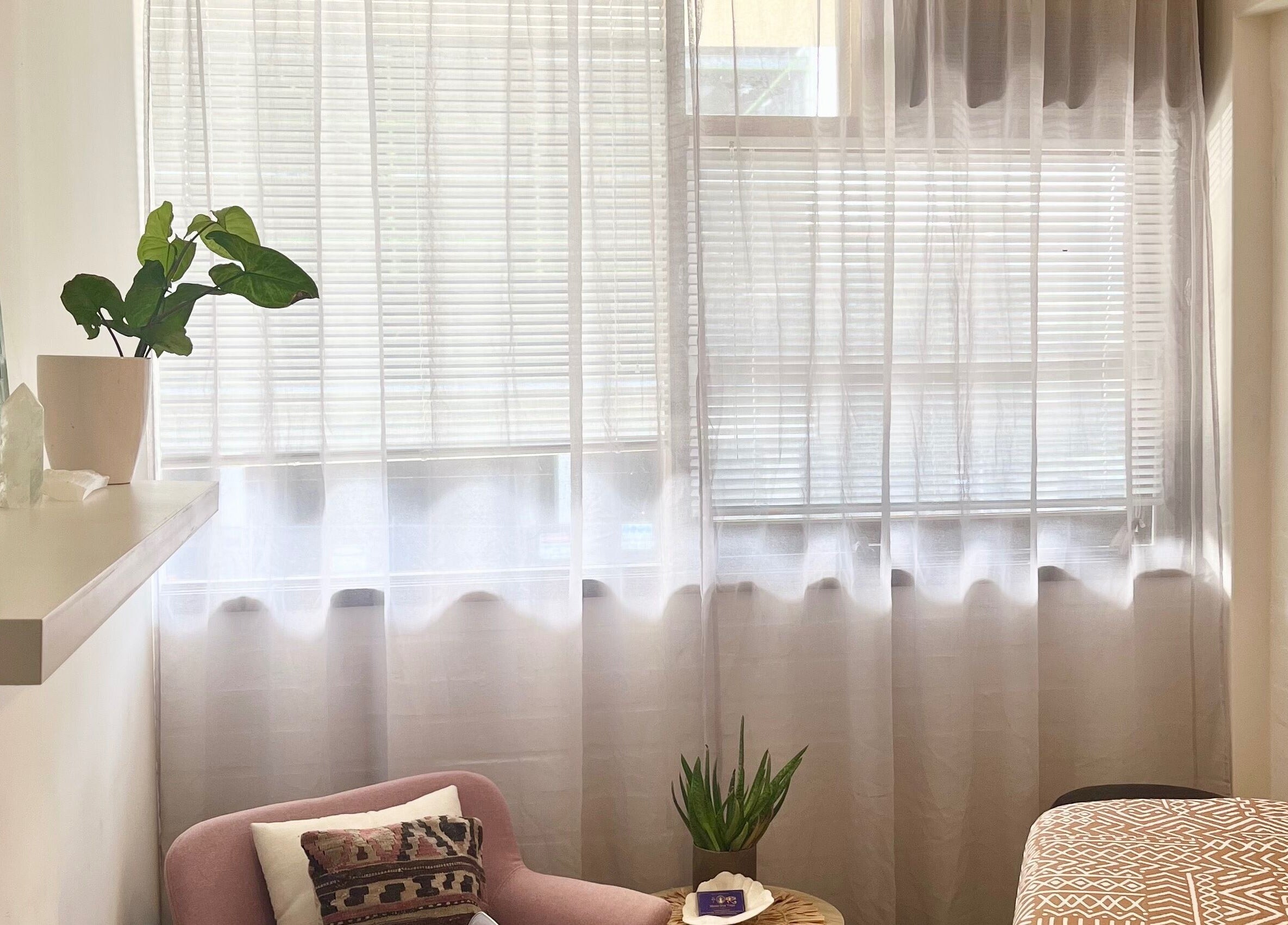 Peaceful corner at Moon Star Yoga, Mona Vale, New South Wales with soft light and cozy seating.