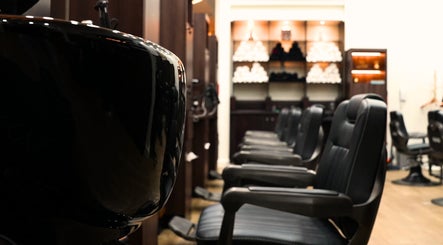 Stylish interior of Hava Gents Salon Ajman khalifa St with sleek black chairs, Ajman, Ajman, AE.