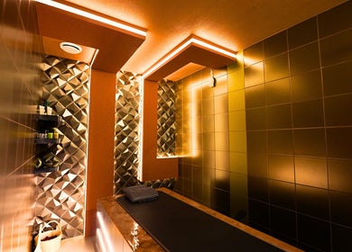 Luxurious treatment room at Hava Gents Salon Ajman khalifa St, Ajman, Ajman, AE with elegant lighting.