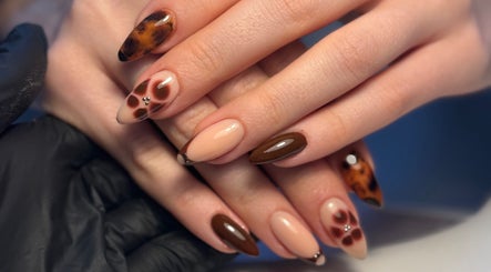 Elegant nail art design at By Cerys Nails, Warrington, England, GB showcasing intricate patterns and glossy finish.