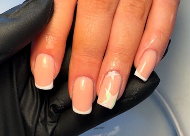 Elegant French manicure by Cerys Nails in Warrington, England, GB. Classic and chic nail design.