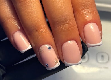 French manicure with nail art at By Cerys Nails, Warrington, England, GB. Beautiful, glossy nails with unique design.