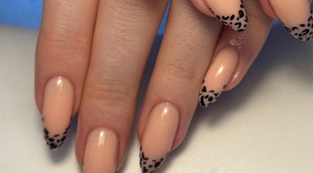 Elegant manicure with leopard tips by By Cerys Nails, Warrington, England, GB. Perfect blend of style and sophistication.