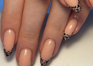 Chic leopard tip nail art by Cerys Nails, Warrington, England, GB, displaying glossy nude polish.