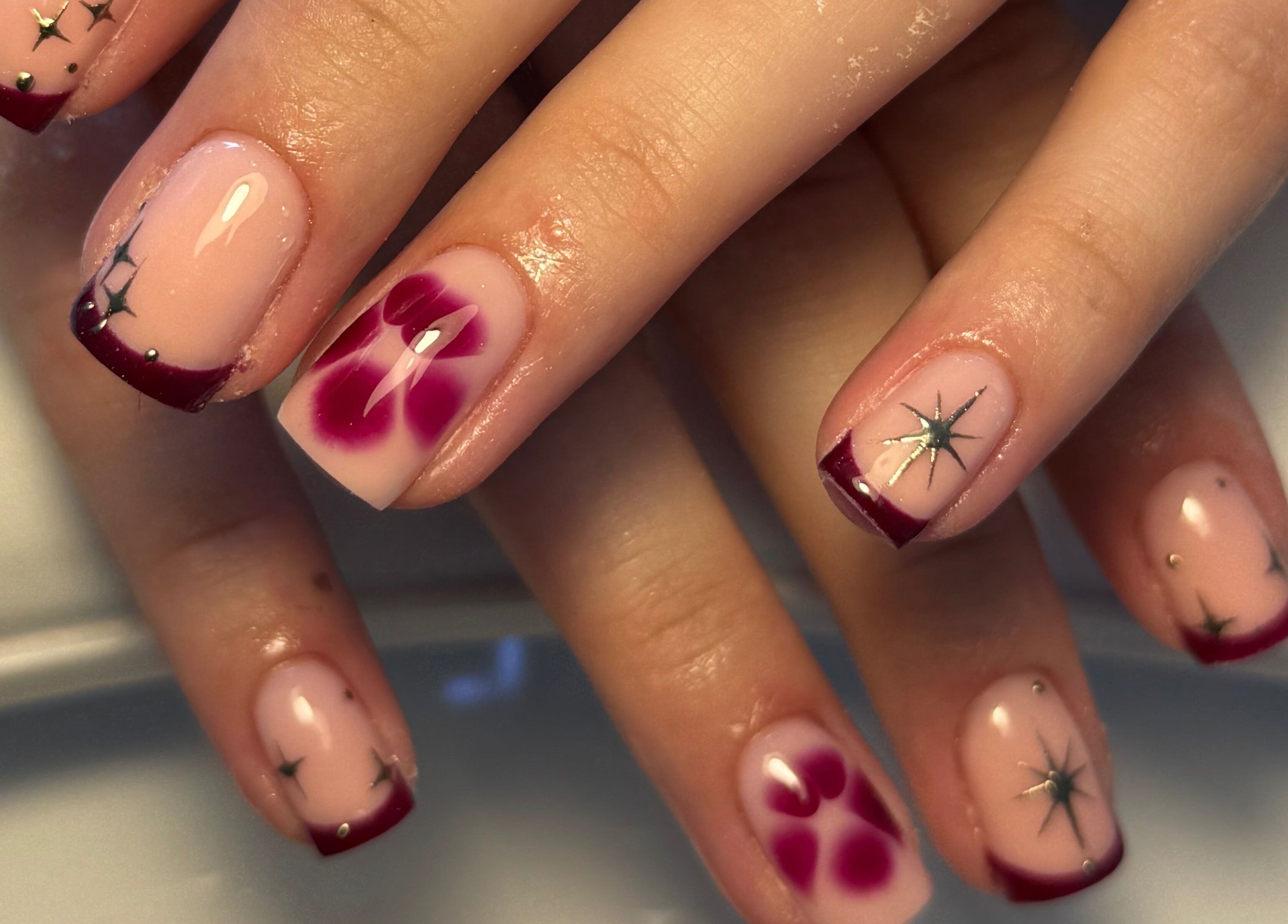 Elegant floral and star nail art manicure by Cerys Nails in Warrington, England, GB.