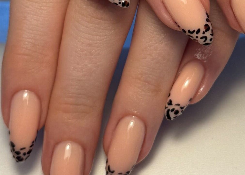 Elegant nail art with leopard tips by Cerys Nails in Warrington, England, GB captures modern sophistication.