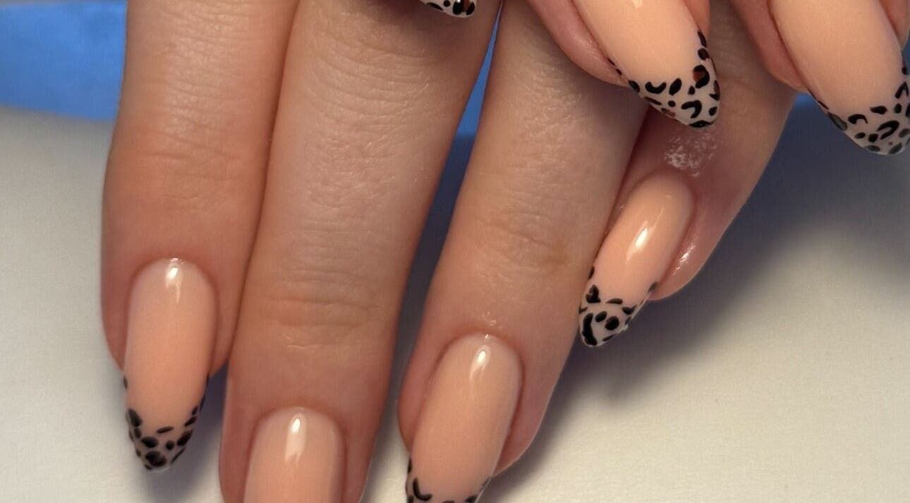 Elegant nail art with leopard tips by Cerys Nails in Warrington, England, GB captures modern sophistication.