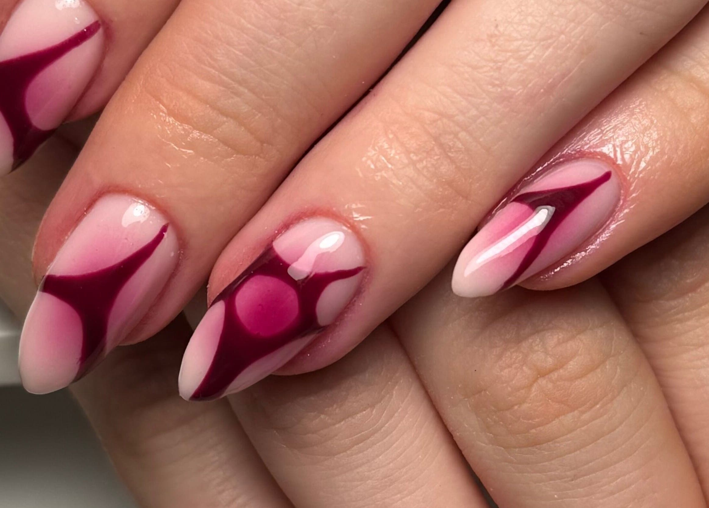 Elegant nail art with pink hues and bold accents at By Cerys Nails, Warrington, England, GB.