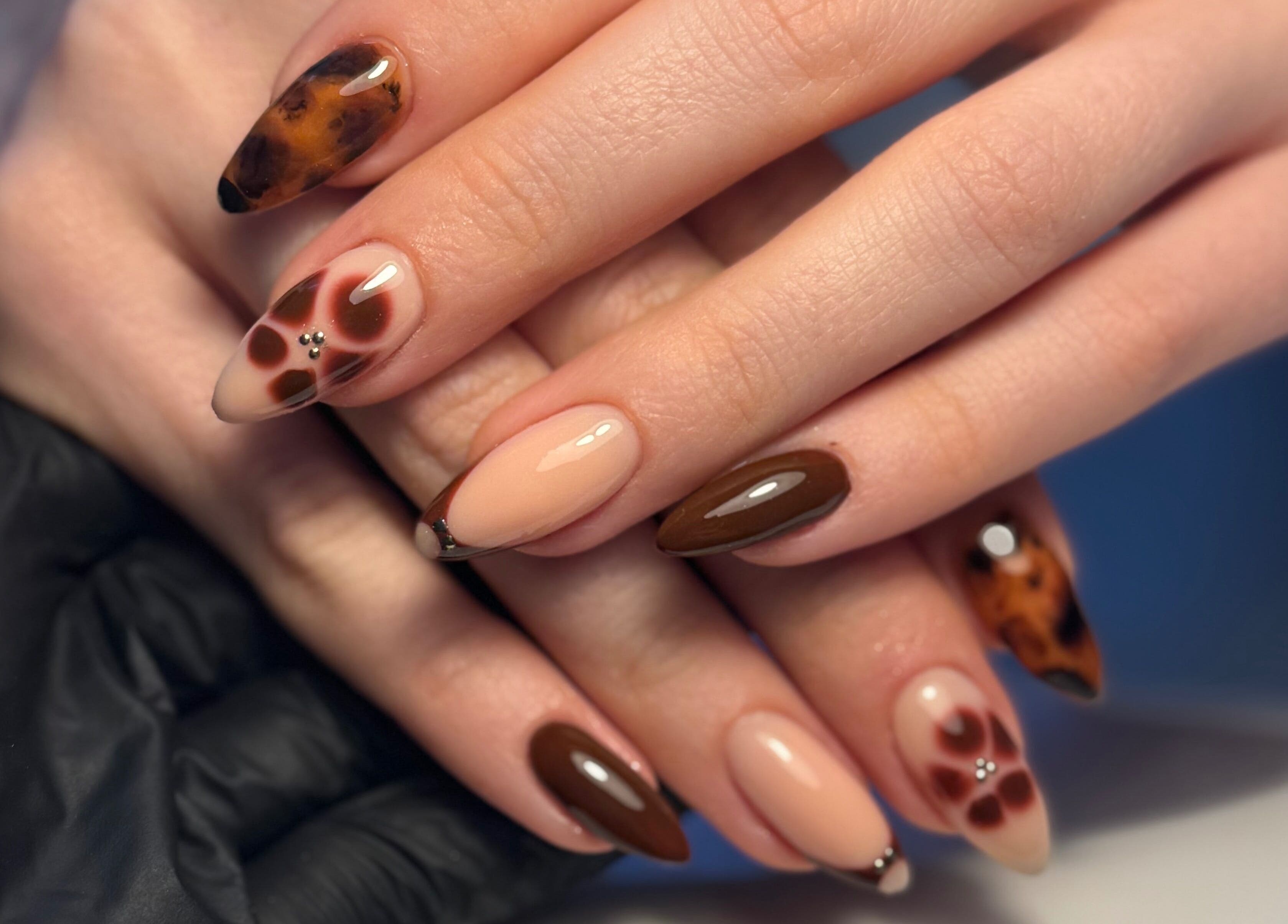 Stunning nail art with floral designs at By Cerys Nails, Warrington, England, GB.