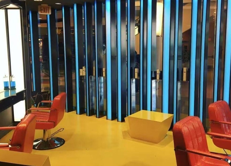 Red chairs and modern decor at Air Plus Hair Salon at Metrotown, Burnaby, British Columbia, CA.