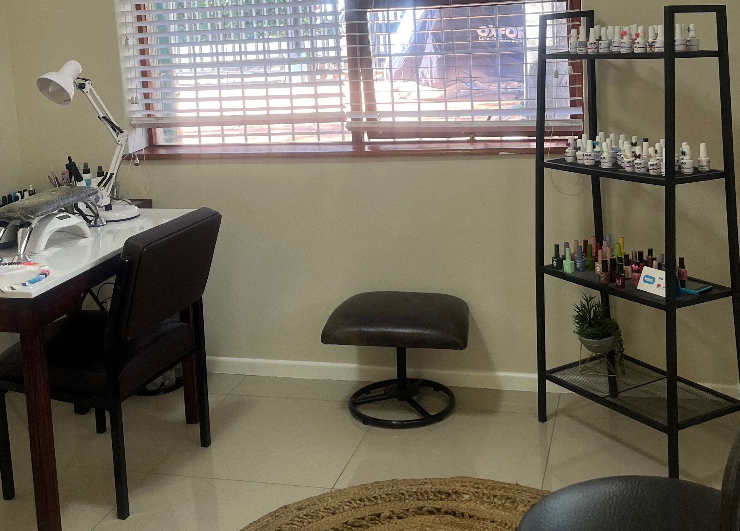 Cozy nail station at Sage Nail and Beauty, Cape Town, Western Cape, ZA, featuring polishes and tools.
