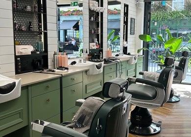 Elegant salon chairs at The Axe Club - Euston, London, England, GB, embody a peaceful and stylish atmosphere.