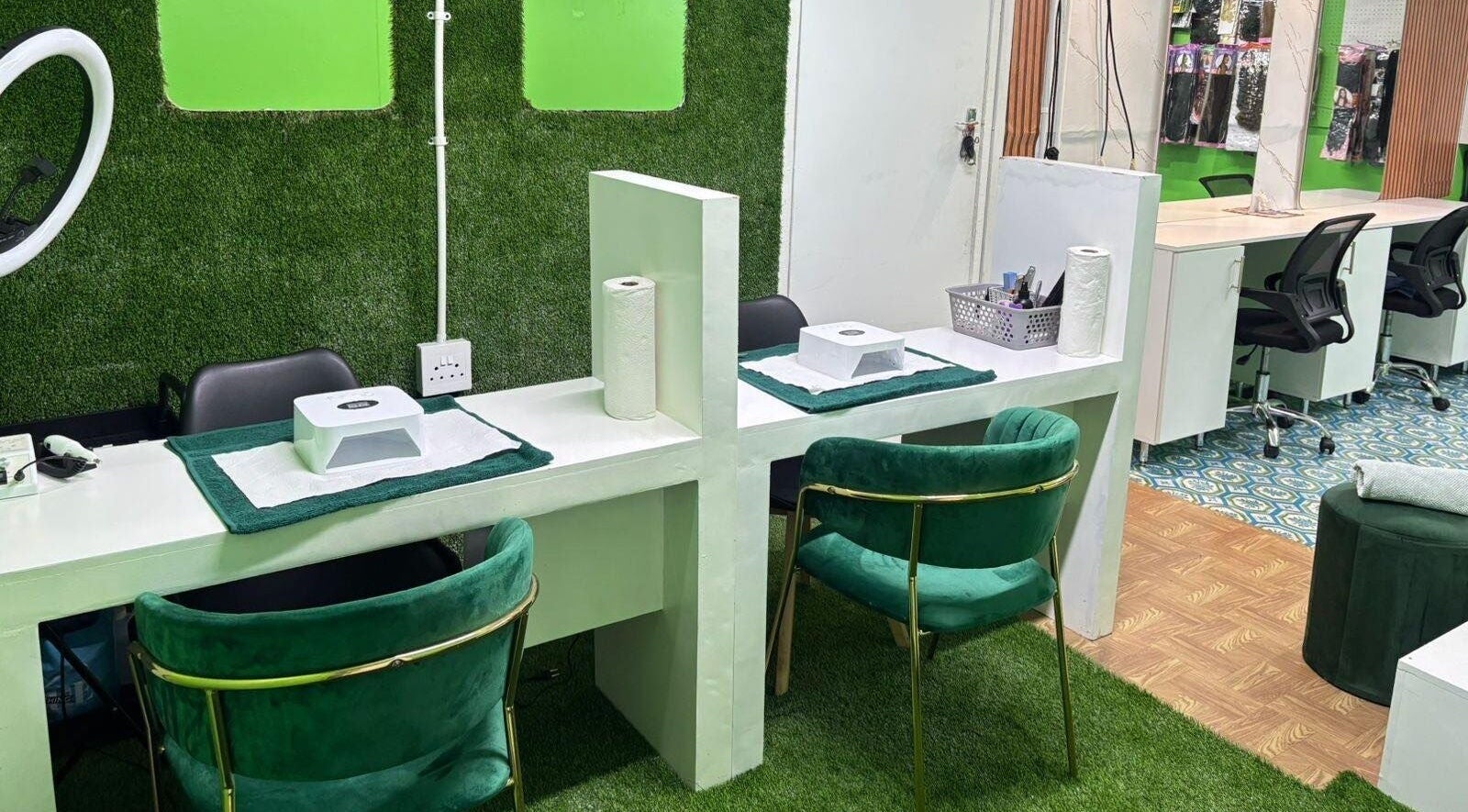 Stylish nail stations at Glamour Glow Nails&Beauty Bar, Cape Town, Western Cape, ZA with green decor.