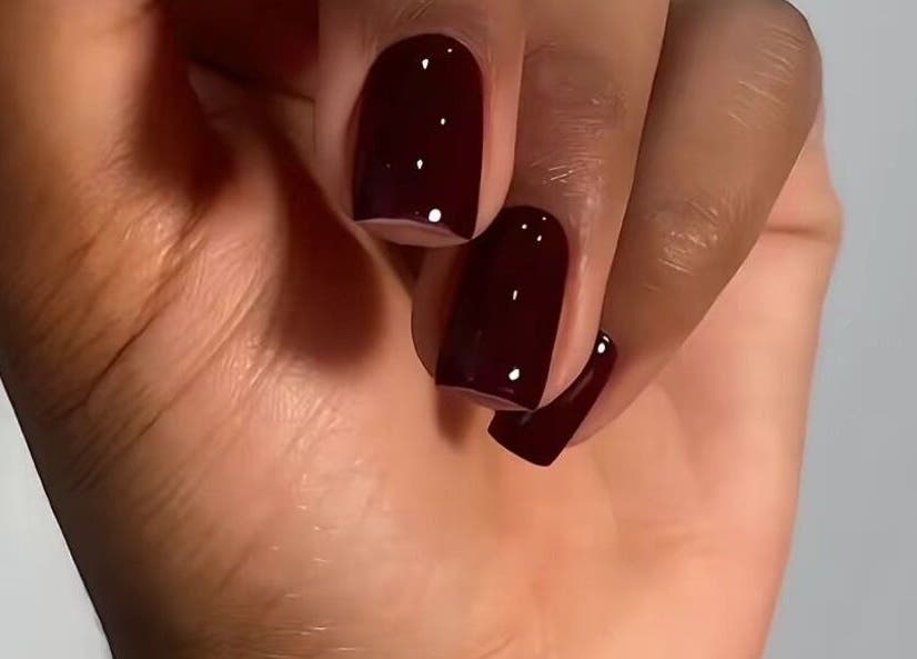 Burgundy nails with gloss finish at Pure Posh Nails, Browns Town, St. Ann Parish, JM. Luxurious manicure close-up.