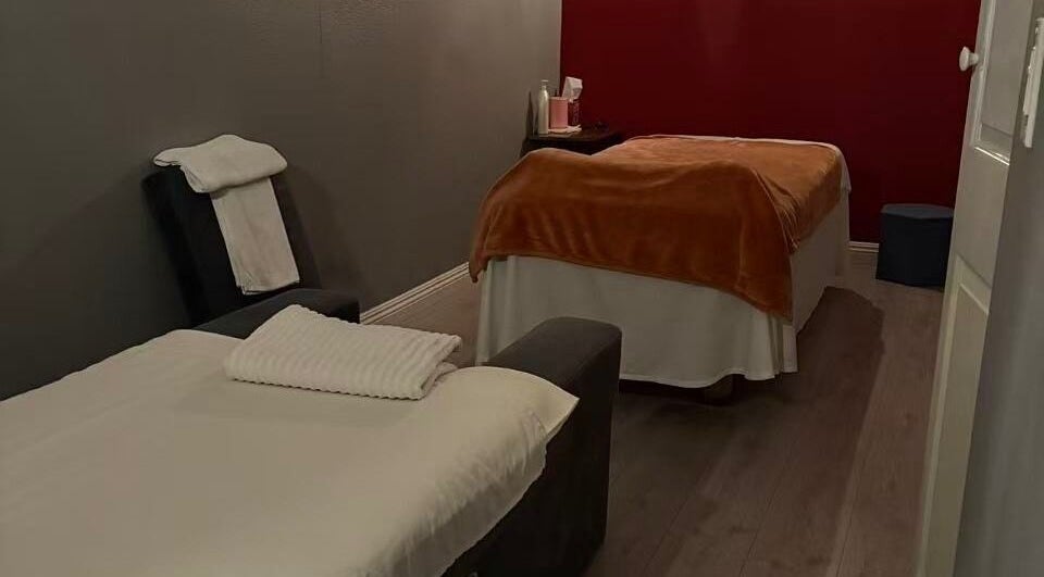 Peaceful massage room at 37 Body Foot Spa, Yorba Linda, California, US with comfy beds and warm ambiance.