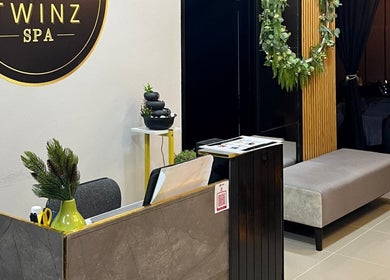 Reception area at Twinz Spa, Rawang, Selangor, MY with elegant decor and a cozy ambiance.