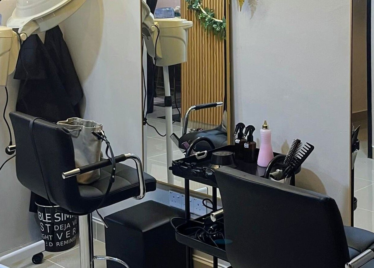 Modern styling station at Twinz Spa, Rawang, Selangor, MY featuring sleek chairs and hair tools.