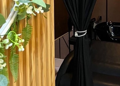 Elegant interior of Twinz Spa in Rawang, Selangor, MY, featuring lush greenery and a sleek black chair.