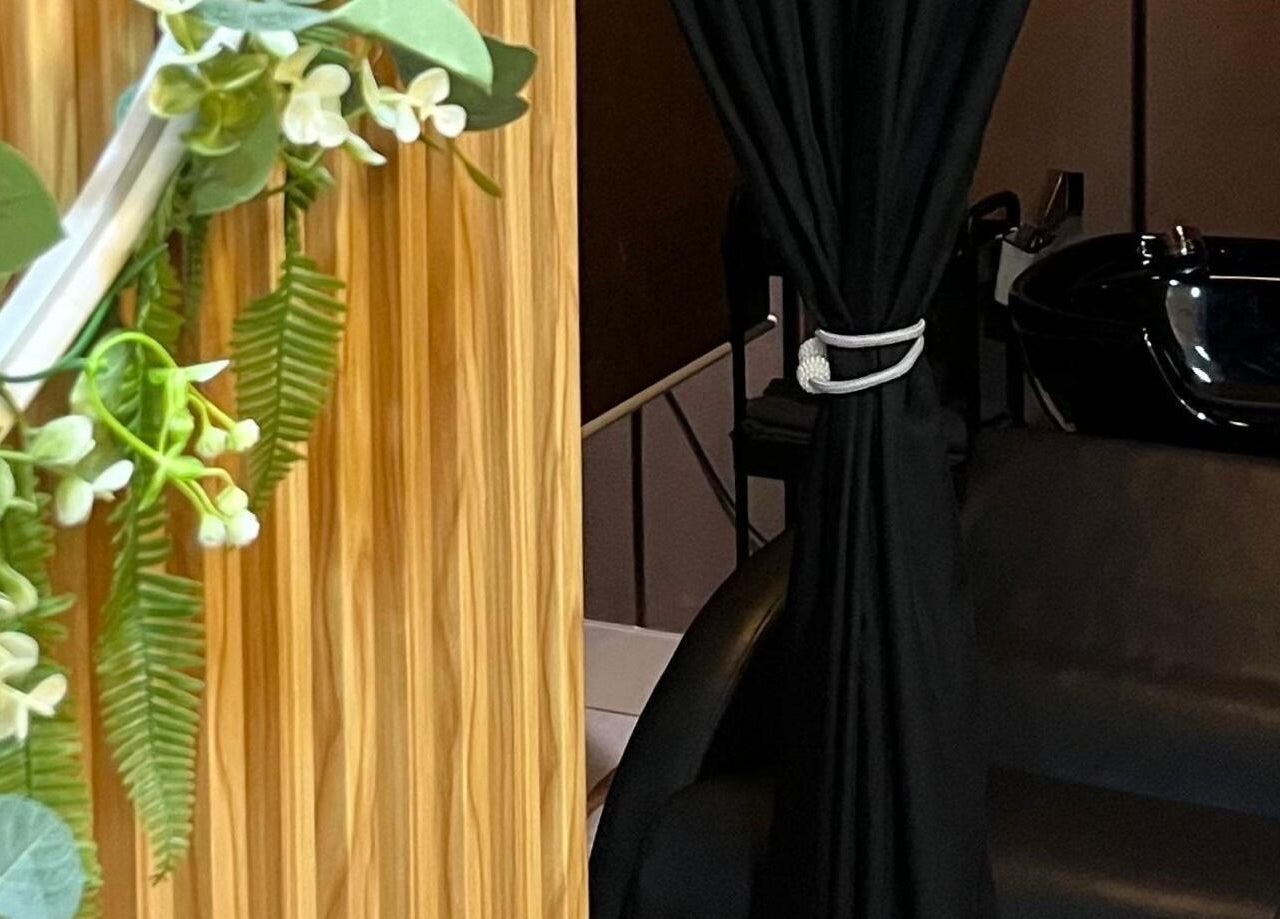 Elegant interior of Twinz Spa in Rawang, Selangor, MY, featuring lush greenery and a sleek black chair.