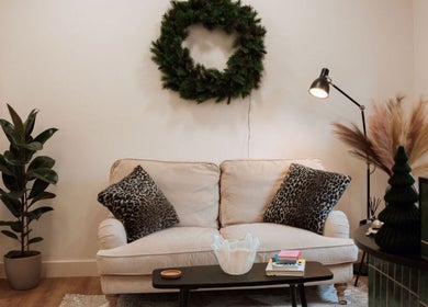 Elegant lounge at The Brow Co. in Loughborough, England. Cozy sofa with stylish decor creating inviting atmosphere.