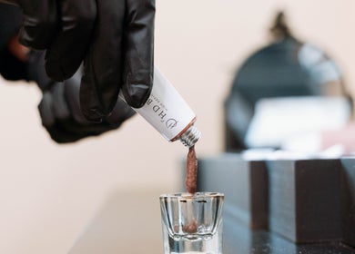 Mixing brow color at The Brow Co., Loughborough, England, GB in preparation for an appointment.