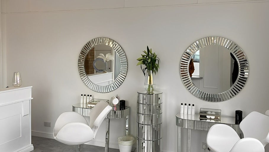 Luxurious beauty station at The Brow Co., Loughborough, England, GB with mirrors and elegant seating.