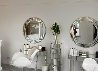 Luxurious beauty station at The Brow Co., Loughborough, England, GB with mirrors and elegant seating.