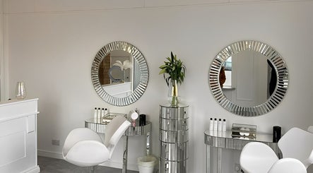 Luxurious beauty station at The Brow Co., Loughborough, England, GB with mirrors and elegant seating.