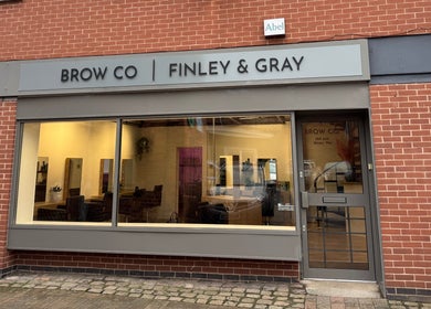 Front view of The Brow Co. in Loughborough, England, GB, showcasing its inviting entrance and glass windows.