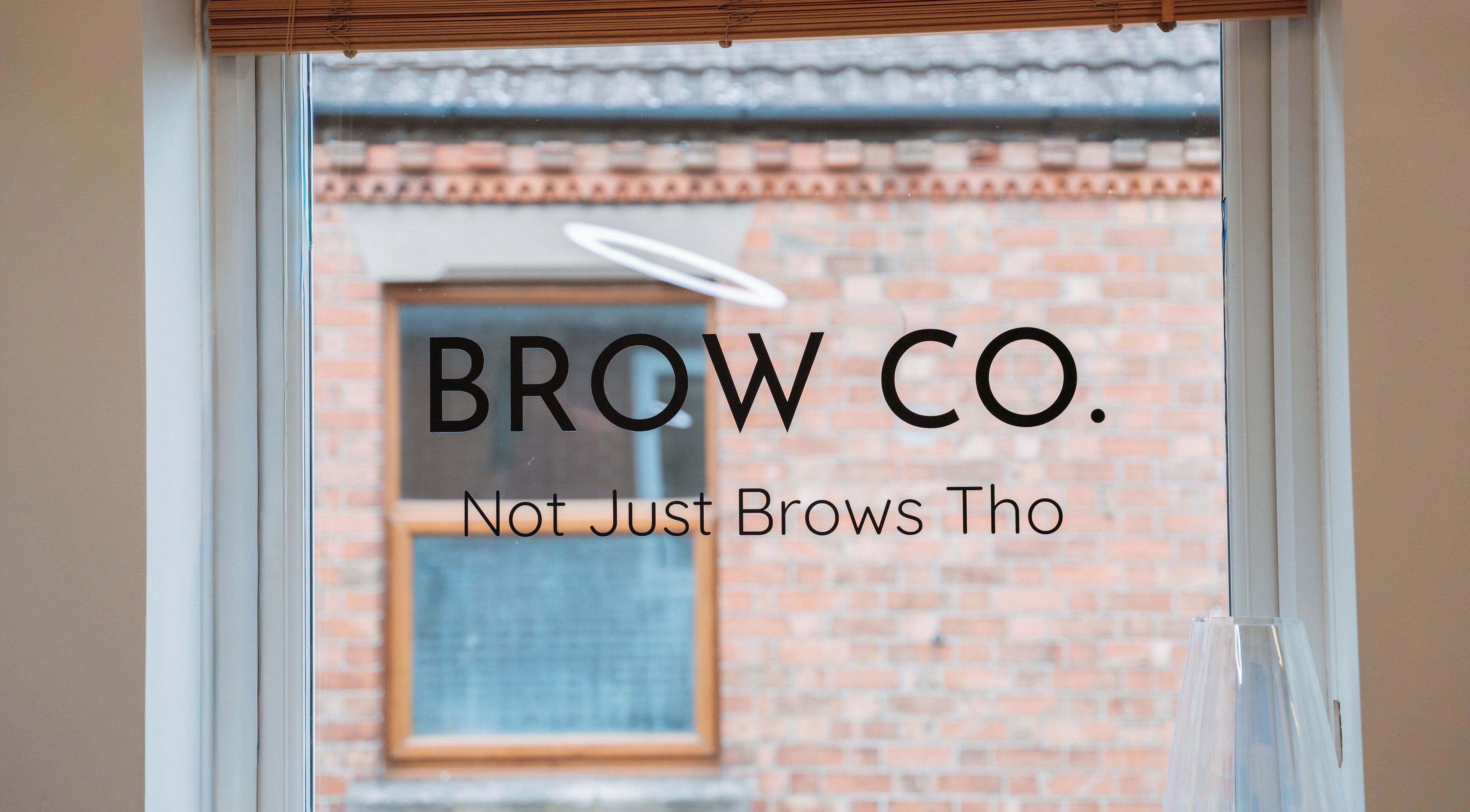 The Brow Co. window sign 'Not Just Brows Tho' at Loughborough, England, GB.