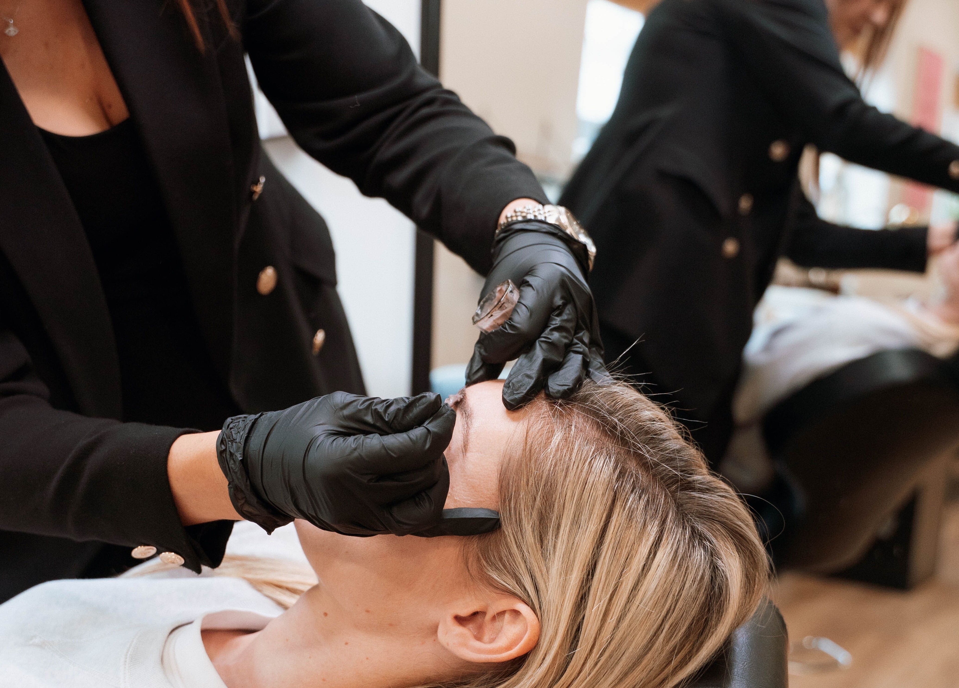 Expert eyebrow shaping at The Brow Co. in Loughborough, England, GB, using precise techniques.