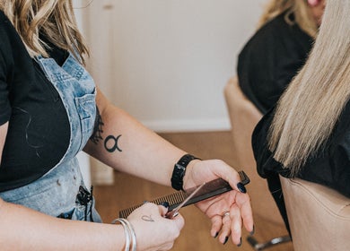 Stylist expertly cuts hair at Artistry Lane by Jessie Lee, Melbourne, Victoria, AU.