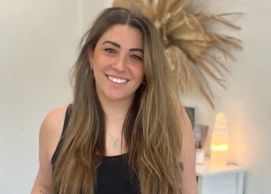 Smiling individual at Artistry Lane by Jessie Lee, Melbourne, Victoria, AU, showcasing beauty and wellness space.