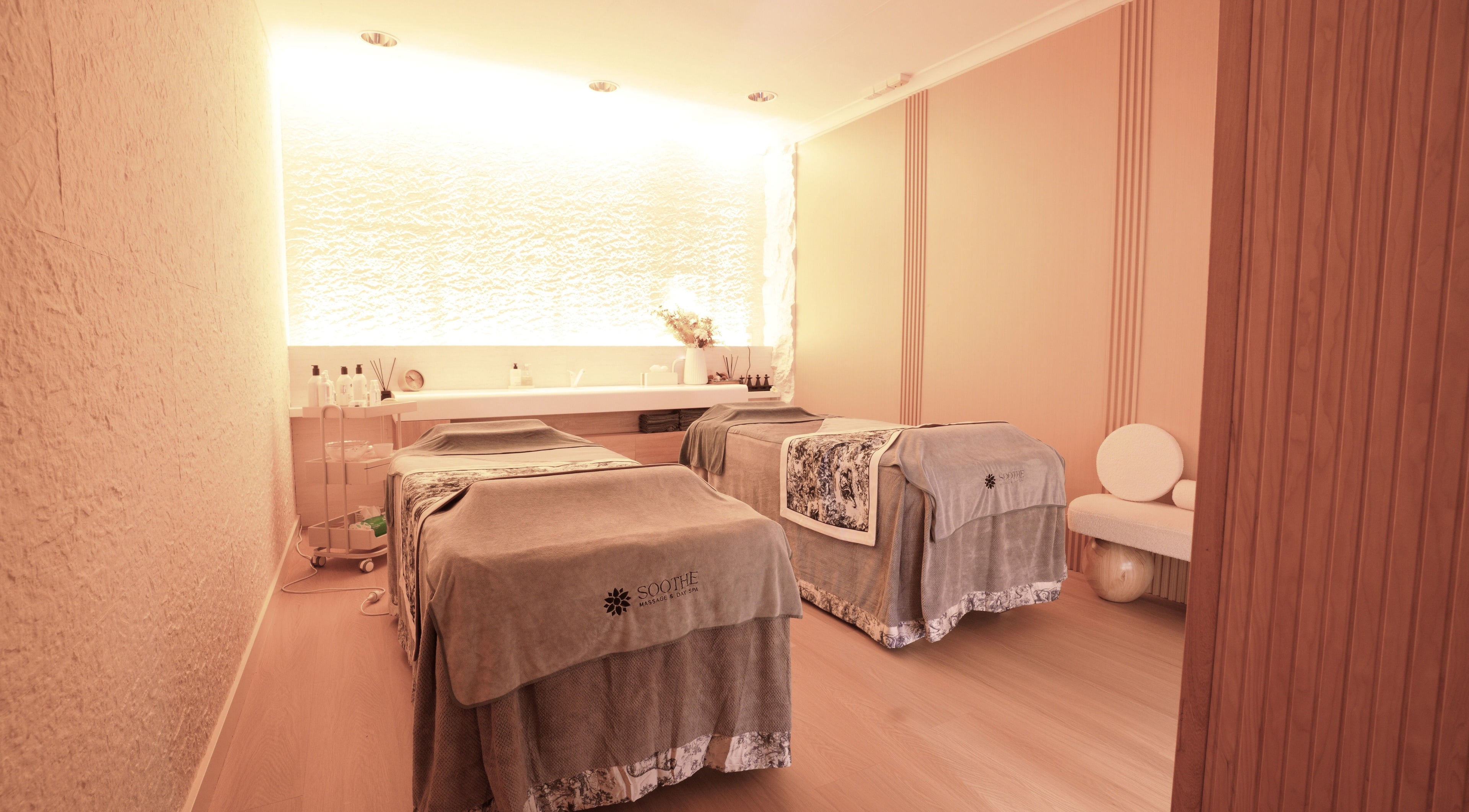Relaxing massage room at Soothe Massage & Day Spa, Nedlands, Western Australia, AU. Cozy ambiance with two massage tables.